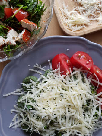 Spinach, cheese and tomatoes for a healthy dietの写真素材