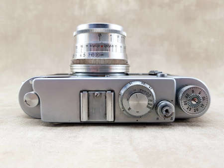 Vintage film rangefinder camera with lens