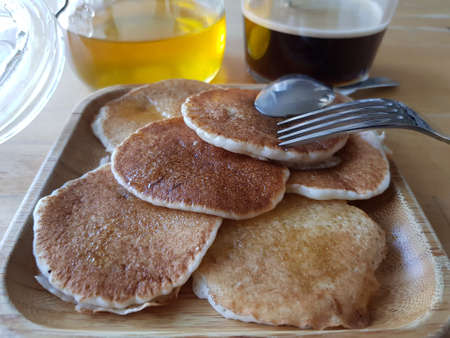 Pancakes drizzled with honey for breakfast