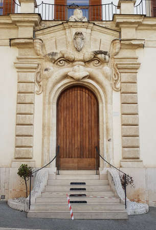 Ancient wooden doors in a medieval buildingの写真素材