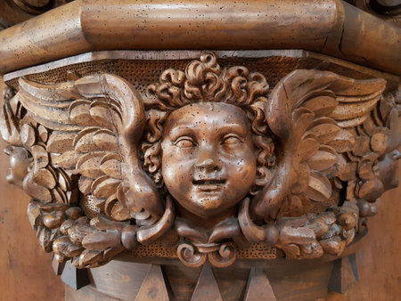wooden antique angel figurine in the churchの写真素材