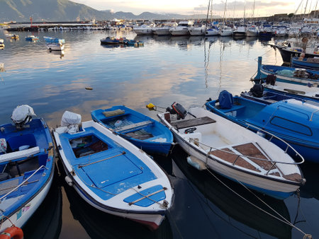 Fishing boats are tied up near the sea