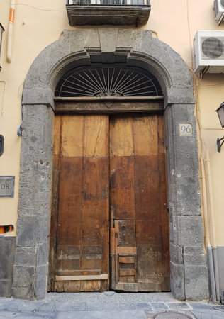 Ancient door in a stone houseの写真素材