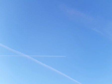 blue sky background with white clouds, soft focus, and copy space