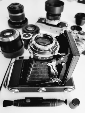 Retro camera and lenses on white background. Shallow depth of fieldの写真素材