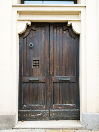 Old wooden door in the old town of Vilnius, Lithuaniaの写真素材