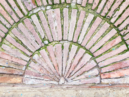 Old brick wall with crack in the center. Abstract background for design.の写真素材