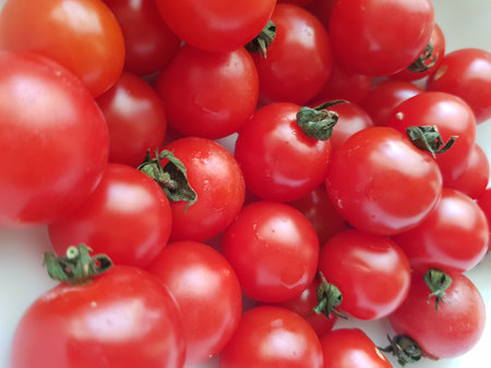 Cherry tomatoes on a white background. Close-up, selective focus.の写真素材