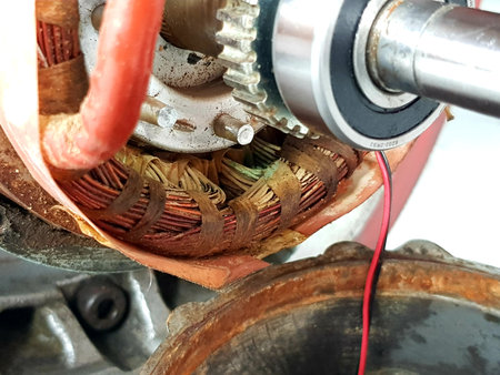 Close up shot of an electric motor with a red cable inside.の写真素材