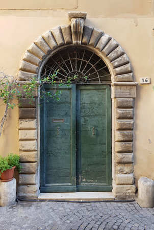 Old wooden door in Rome, Italy.の写真素材