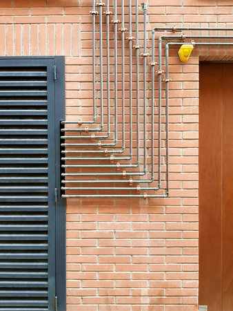 metal shutters on the brick wall of the building, close-upの写真素材