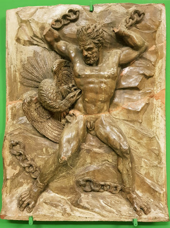 A bas-relief depicting a giant eagle pecking the liver of Prometheus in chains.