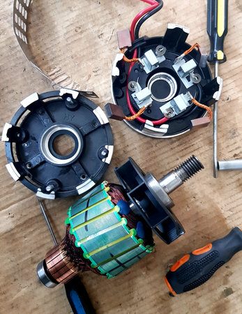 Electric motor and tools on a wooden background. Top view with copy space.の写真素材