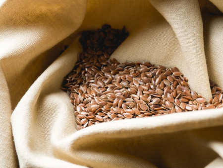flax seeds on linen clothの写真素材