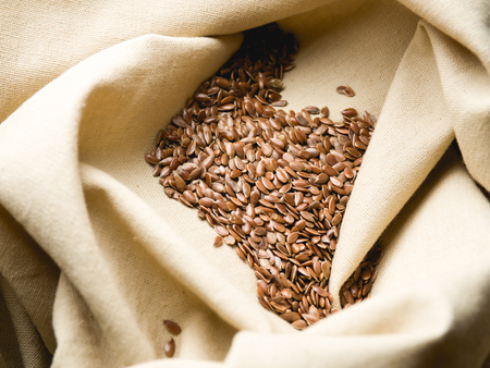flax seeds on linen clothの写真素材