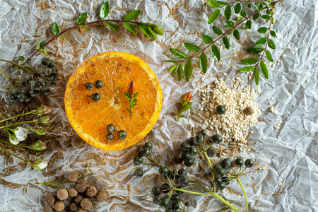 Orange and spices on craft paperの写真素材