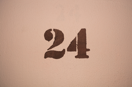 The number twenty four painted on the wallの写真素材