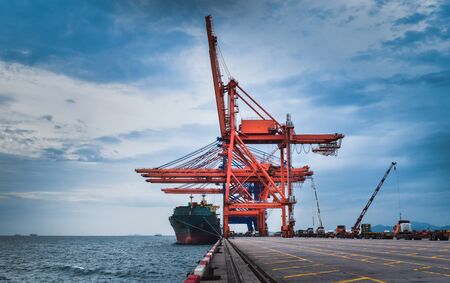 Container ship and gantry crane at jetty port.の写真素材