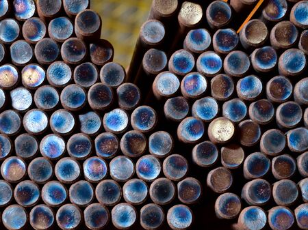 Closed up of steel rod bar in bundle stack inside warehouse. Round shape pattern.の写真素材