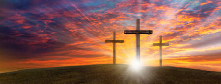 Wood cross of Jesus crucifixion and resurrection with bursting sunray background. Christianity and spiritual concept.の写真素材
