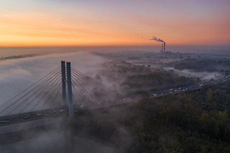 The Siekierkowski Bridge during a misty morning and sunriseの写真素材