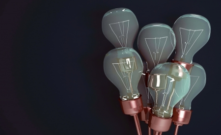 Light bulbs on a background a dark green wall.の写真素材