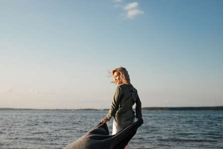 woman walks along the beachの写真素材