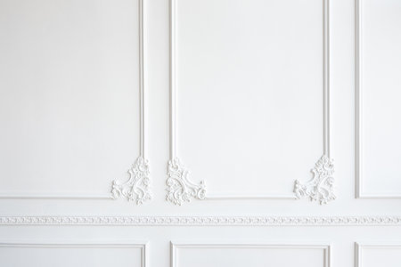 white wall decorated with stucco in the form of decorative curls