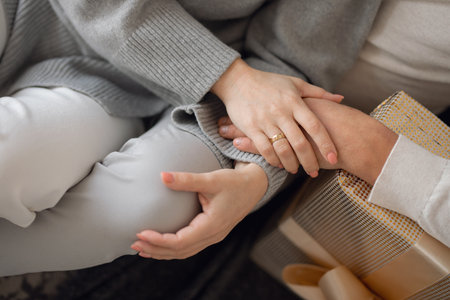woman and man holding hands, close-up