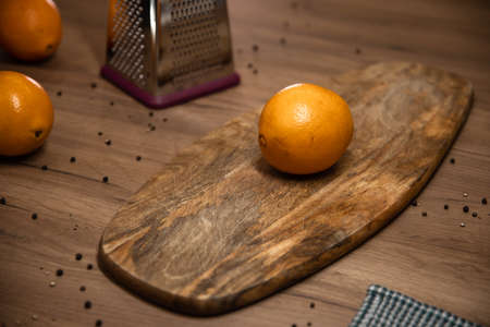 orange lies on a wooden boardの写真素材