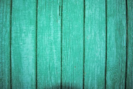 The Wooden wall of the green colour. The Mangy paint. Aging wall.の写真素材