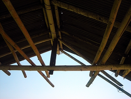 Roof structure which made from bamboo. against the blue sky