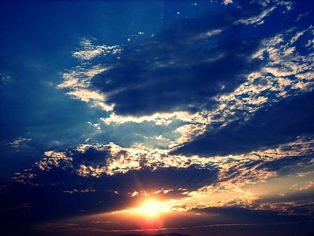 Colorful sunset behind the mountainsの写真素材