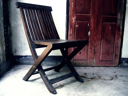 Wooden old chair. Textured backgroundの写真素材