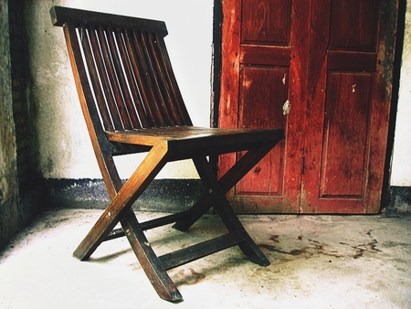 Wooden old chair. Textured backgroundの写真素材