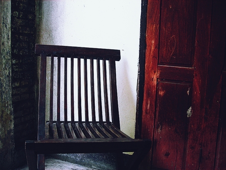 Wooden old chair. Textured backgroundの写真素材
