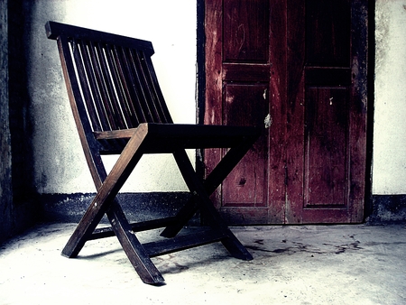 Wooden old chair. Textured backgroundの写真素材
