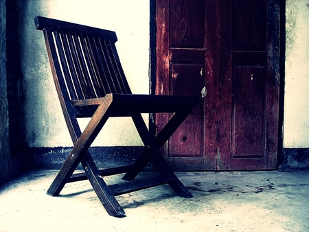 Wooden old chair. Textured backgroundの写真素材