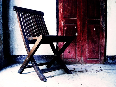 Wooden old chair. Textured backgroundの写真素材