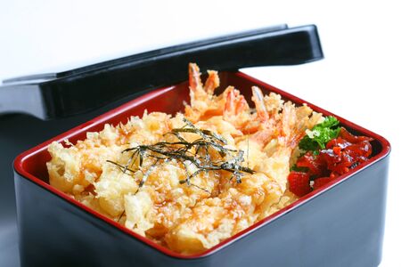 Ebi tempura don or Ebi Kakiage served with red pickled vegetables (Fukujin Zuke) in white backgroundの写真素材