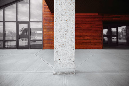 Modern office building with concrete columns. Architectural background. Toned.の写真素材