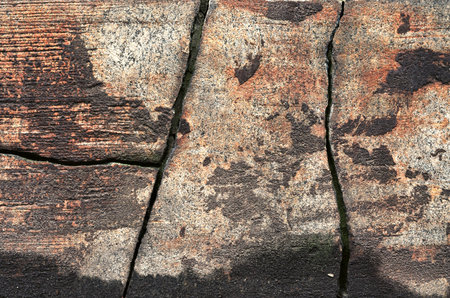 Old brick wall with cracks and scratches. Abstract background for design.