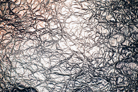 Crumpled aluminum foil texture background for web site or mobile devices.