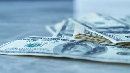 Close up view of cash money dollars bills in the amount