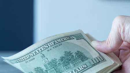 Close up view of cash money dollars bills in the amount
