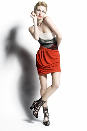 Fashionable beautiful women in red dressの写真素材