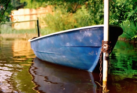 Pedal-boat, tied to a post.の写真素材