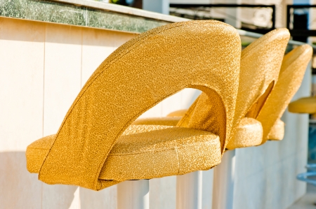 retro patterned chairs at the barの写真素材