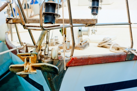 Rusty anchor on the bow deck of a yacht.の写真素材