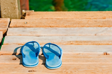slates on a wooden pier near the seaの写真素材